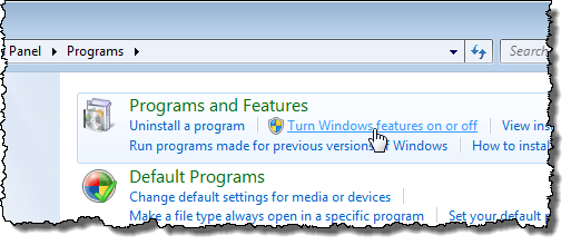 Mengklik Mengaktifkan atau menonaktifkan fitur Windows di Windows 7
